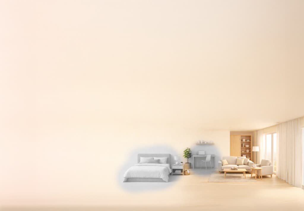Softly lit room background showing bedroom, desk, and living space